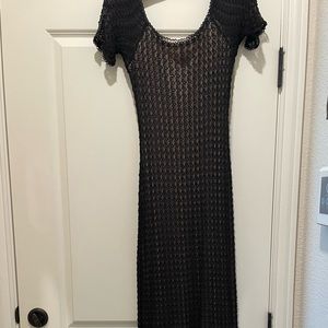 Black full length formal gown.